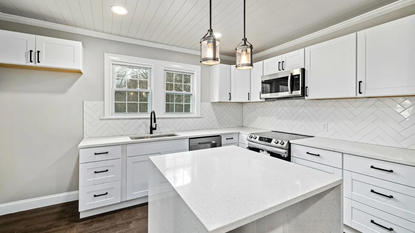 White kitchen remodeling project by JPK Construction in Presque Isle ME